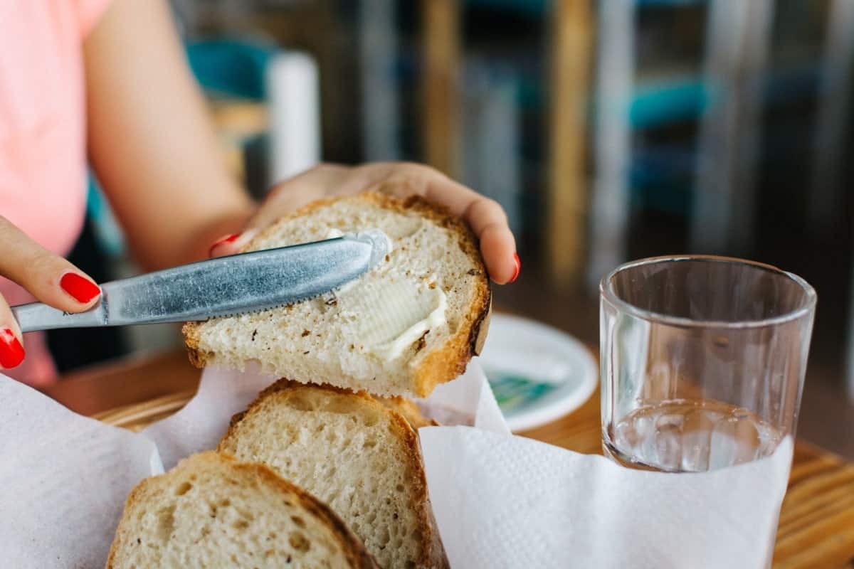 Buttering Bread representing spreading yourself too thin