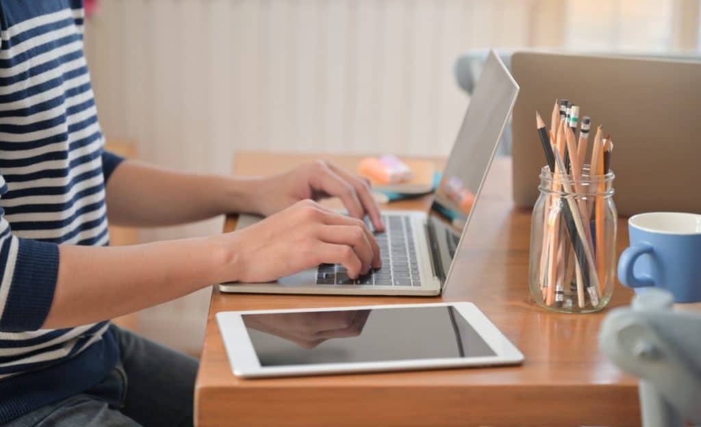 Is bluehost good for blogging - Person writing a blog post