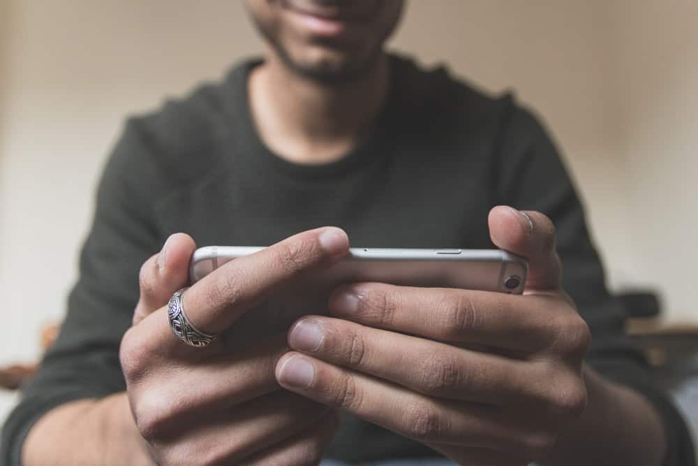Man watching YouTube to see why his videos are not getting views